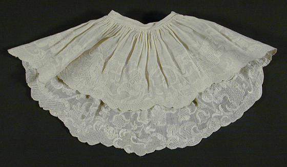 a white lace collar, partially fashioned in the back, for a costume