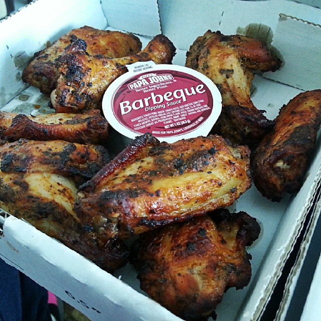 a box of barbecue chicken wings in the middle