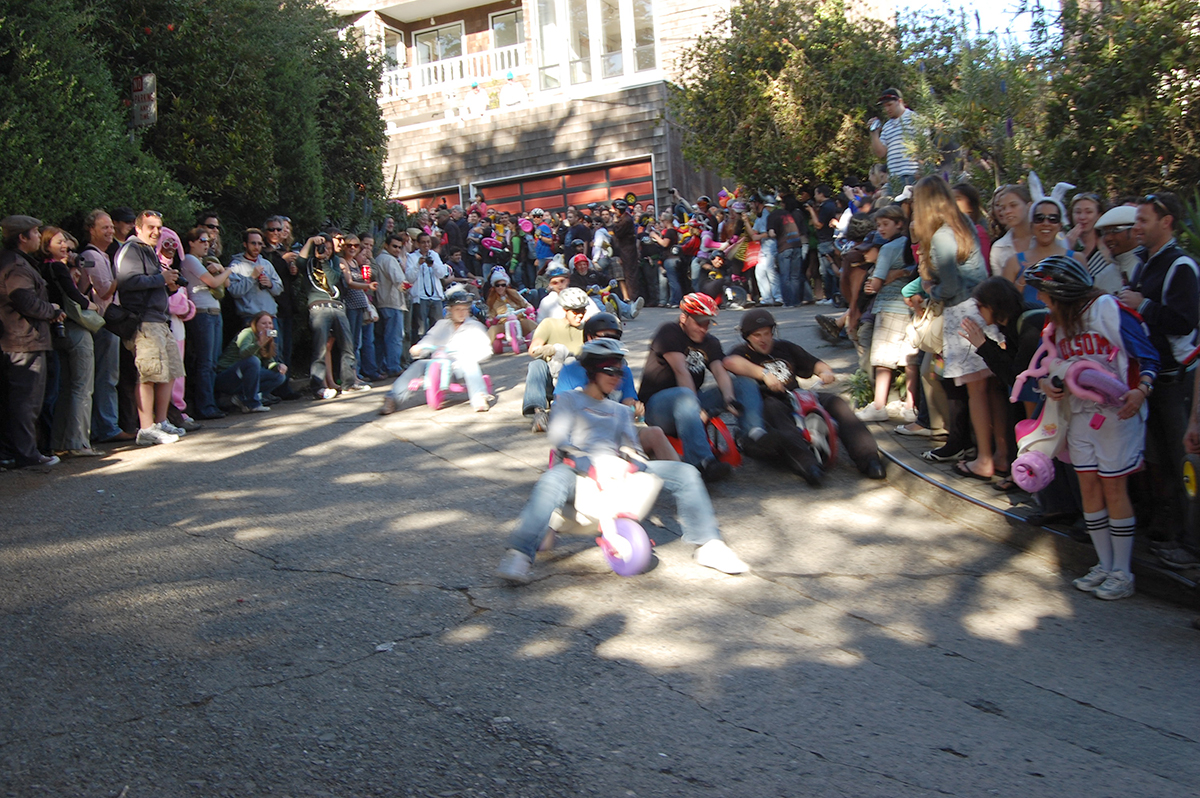 a group of people standing around a woman holding a white stuffed animal