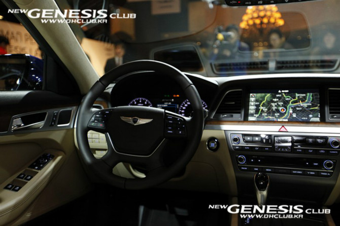 dashboard view of the inside of a car with a steering wheel