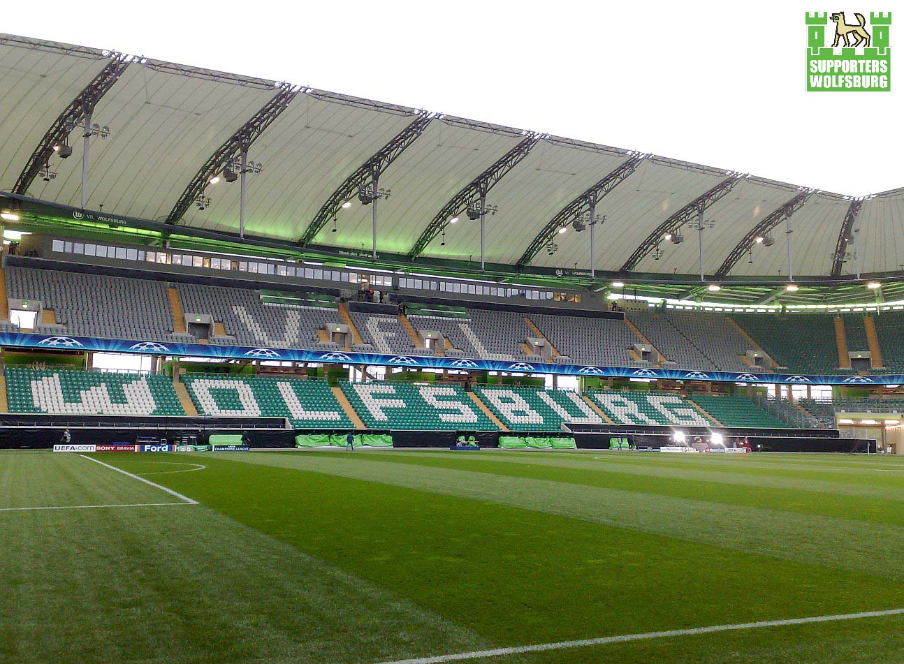 a large stadium has many green seats