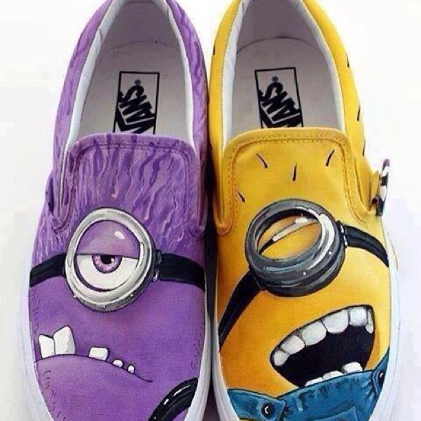 a pair of shoes painted to look like minionsette characters
