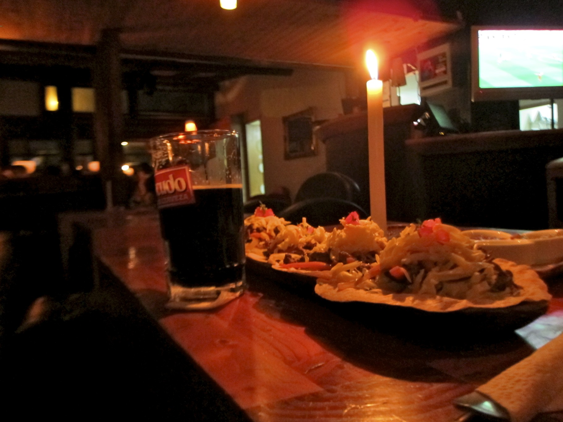 a plate of food with a candle next to it