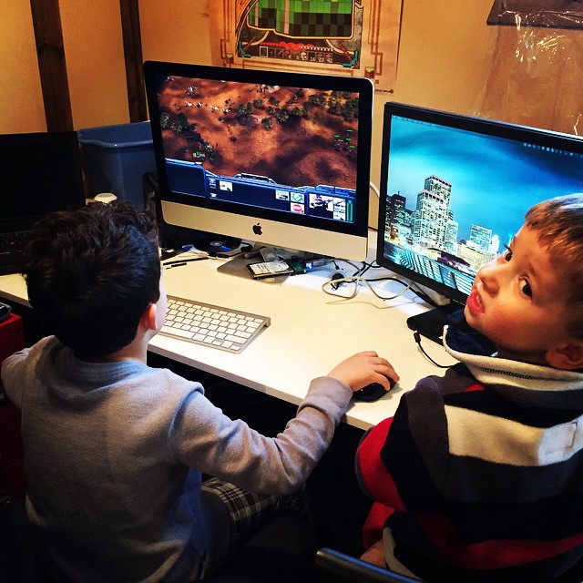 two s playing a video game on their computer