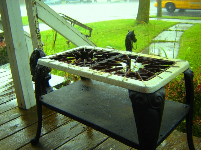 a pot burner on a picnic table outside
