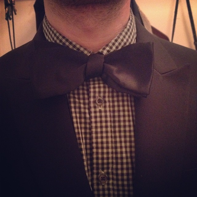 man wearing a brown and black bow tie