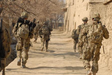 a group of men running along the road together