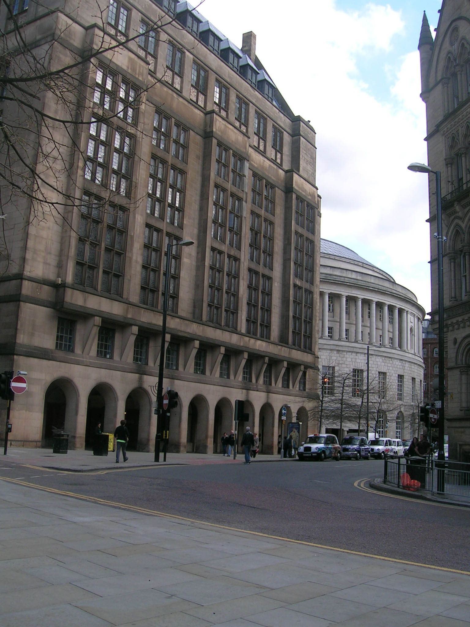 a wide city street with several very big buildings