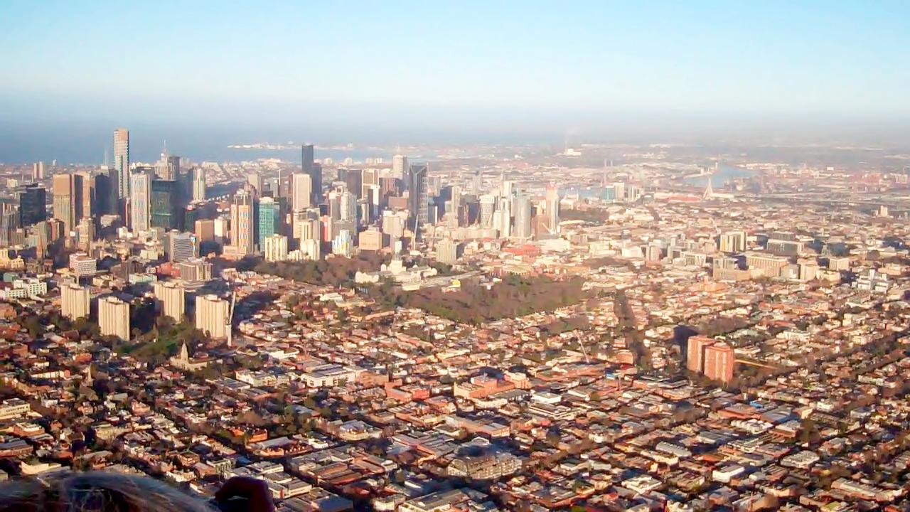 the city skyline is shown from a very high altitude view