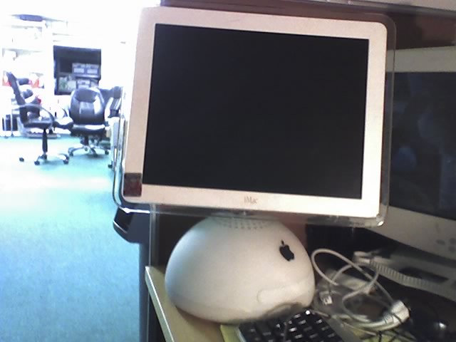 a desktop computer monitor sitting on top of a keyboard and mouse