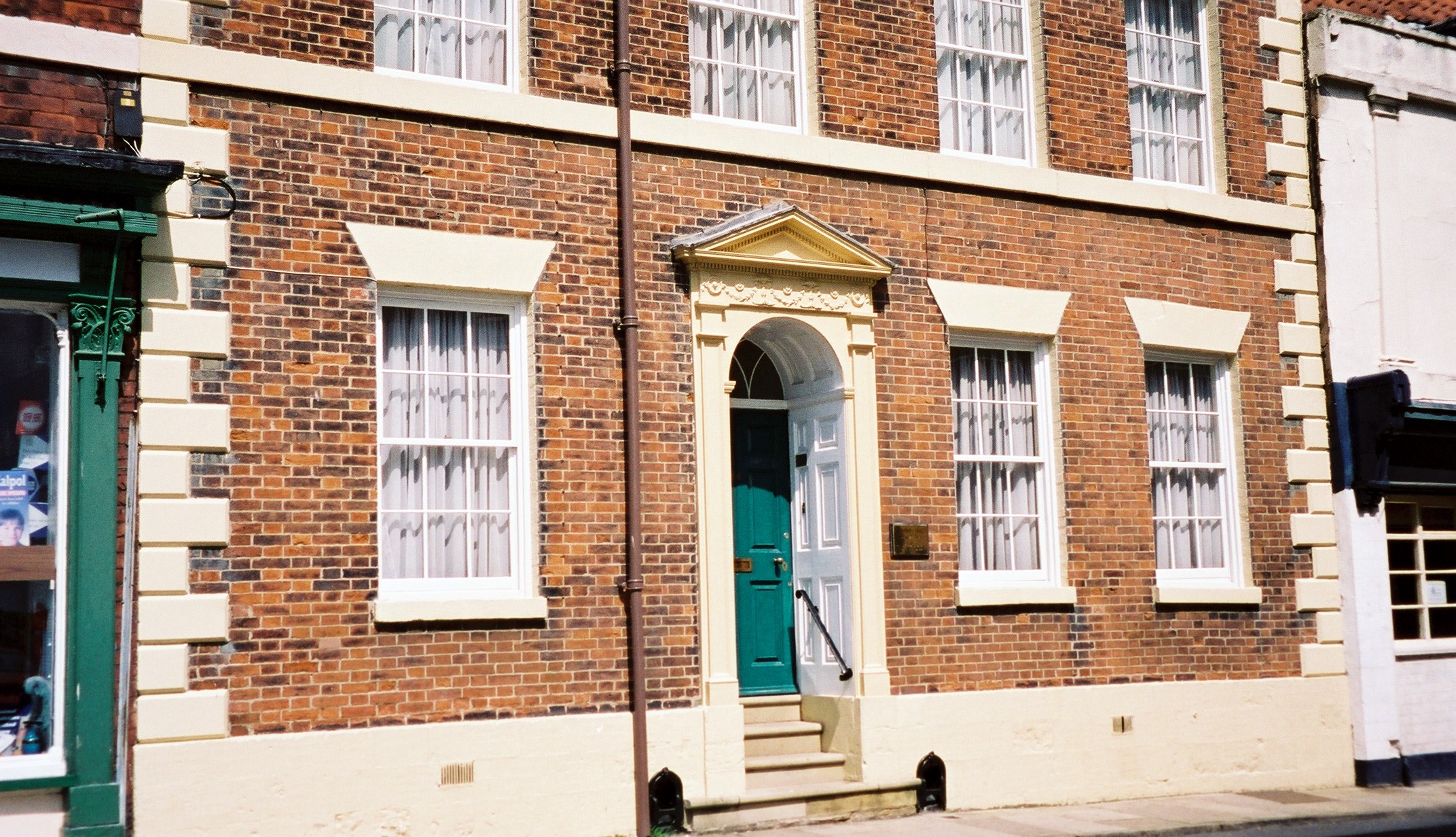 a tall brick building with windows on both sides