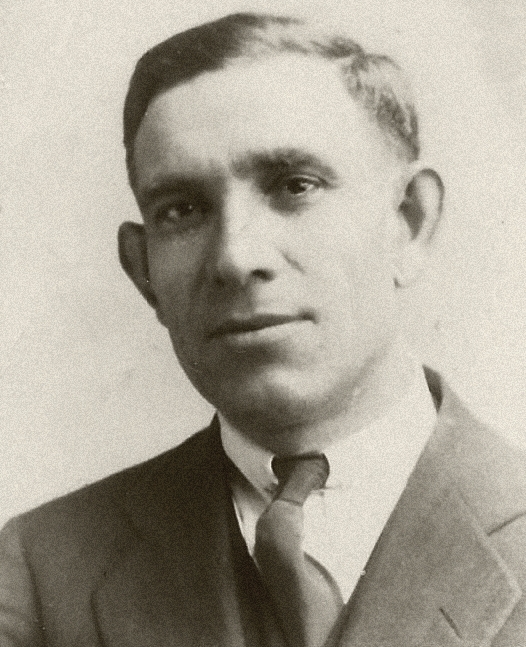 a black and white pograph of a man wearing a suit