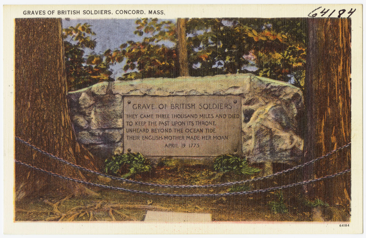 a memorial sign in the woods by some trees