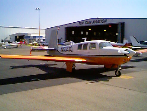 a small airplane sitting at a station in a airport