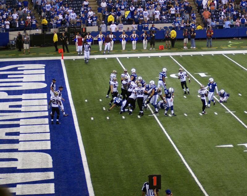 a group of football players playing against each other