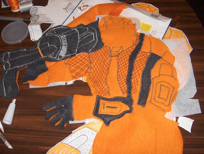 an orange jacket is cut out and on the table