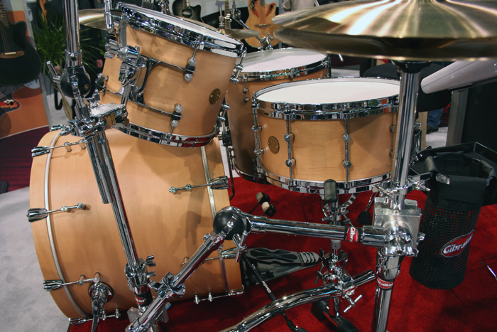 a drumset and cycsle with several sound equipment