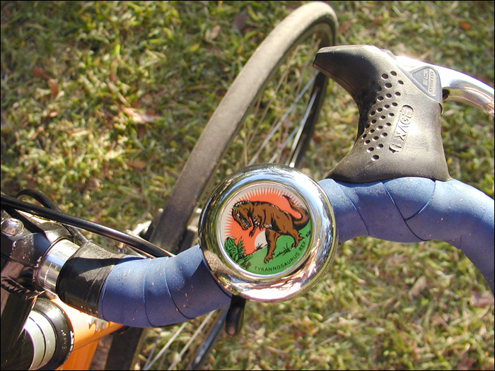 the handlebars of a bicycle are decorated with a picture of a bear