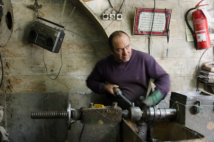 a man making electrical work in his garage