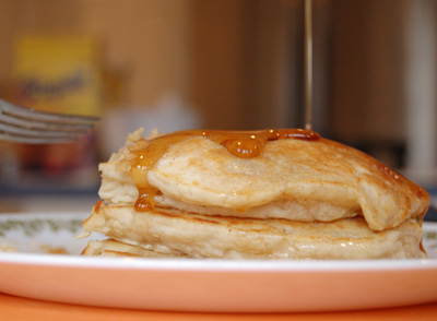 a plate with pancakes sitting on top of a table
