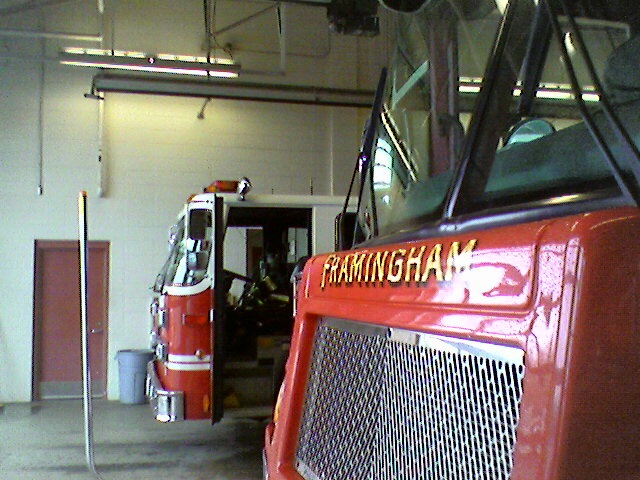 the front of a fire truck that is parked in the garage
