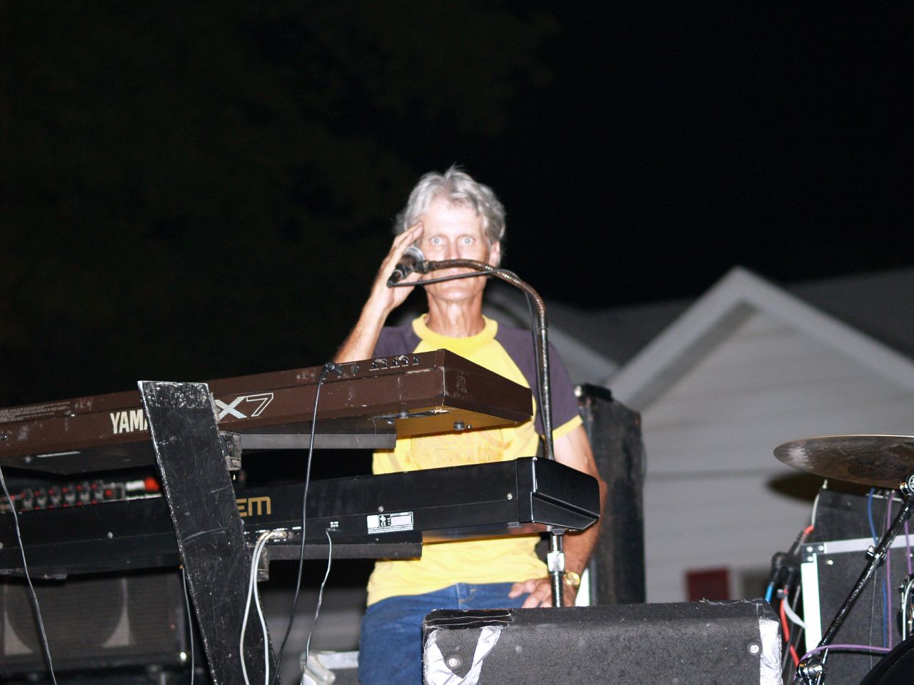 a man is playing on keyboards with the music equipment