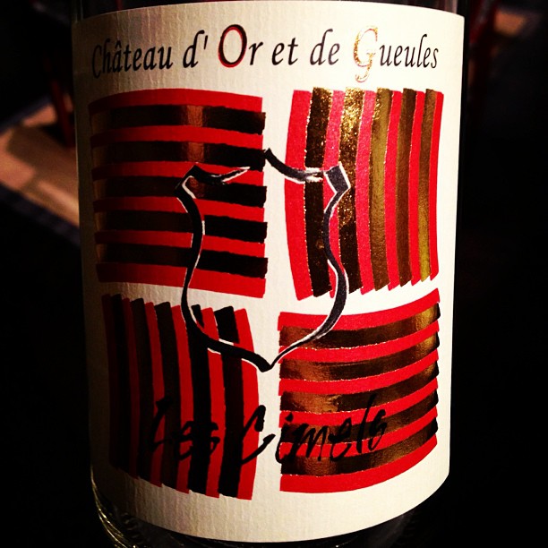 bottle of red wine with red and black stripes