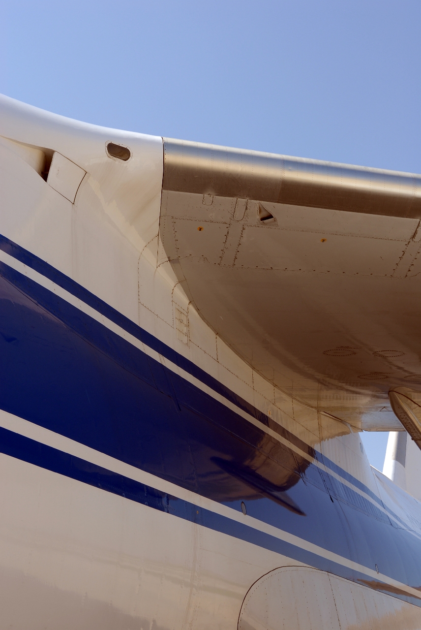 a view from the side of an airplane, looking up at it