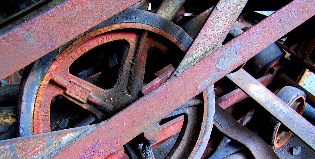 a pile of old rusty wheels and wheels