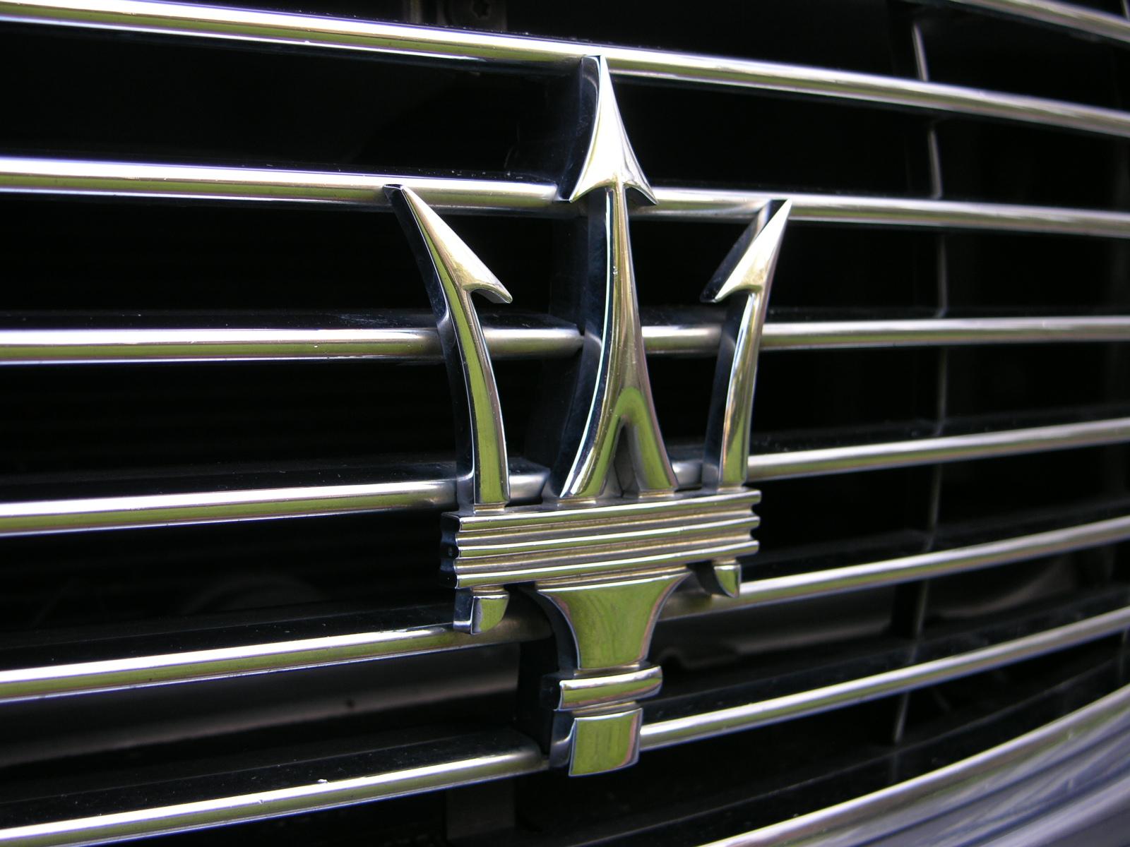 a close - up po of a black and chrome emblem on a shiny car