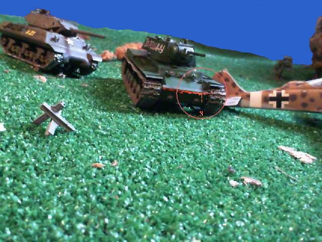 three army war tank models, one red and one gray