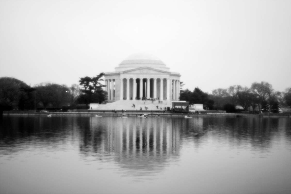 a large building sitting next to a lake