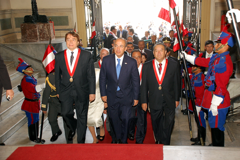 the four men in suits are marching up steps