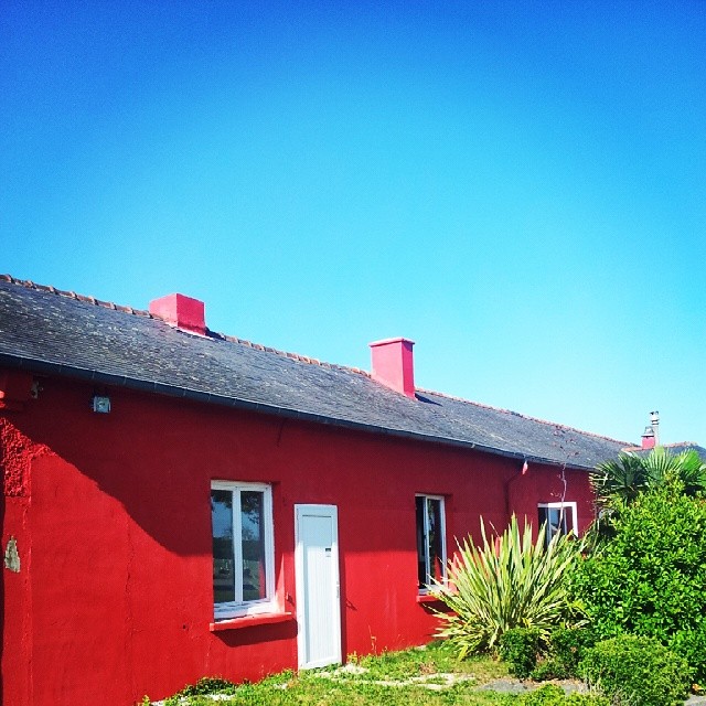 a house painted red with white trim