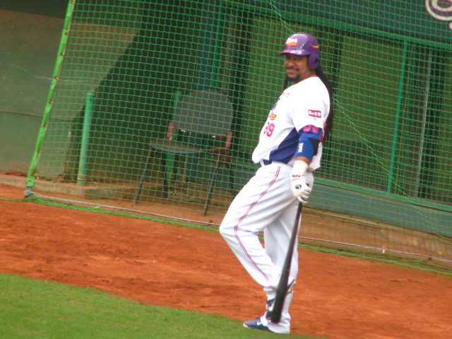 a baseball player getting ready to run on the field