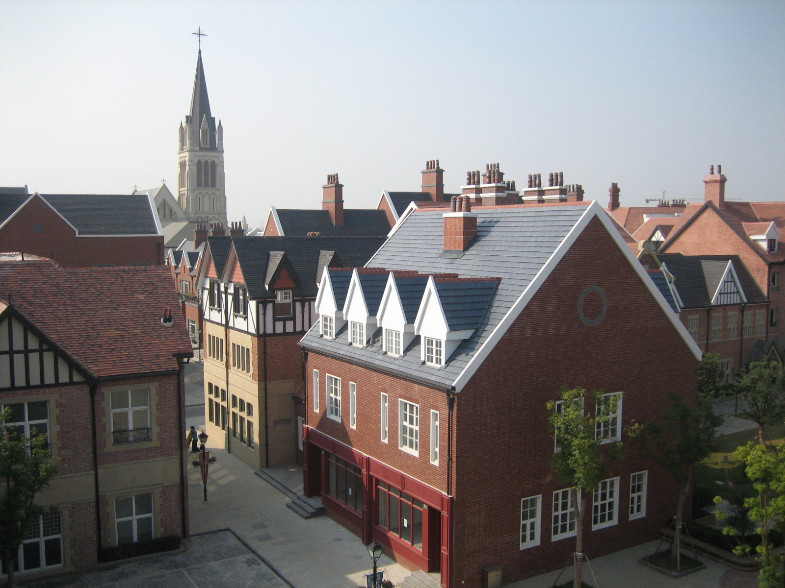 buildings with a spire on top and tall towers