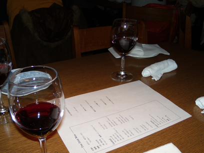 two wine glasses sit next to each other on a table