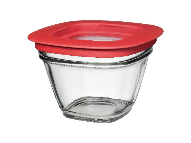 a glass cup with a red lid and a sippy