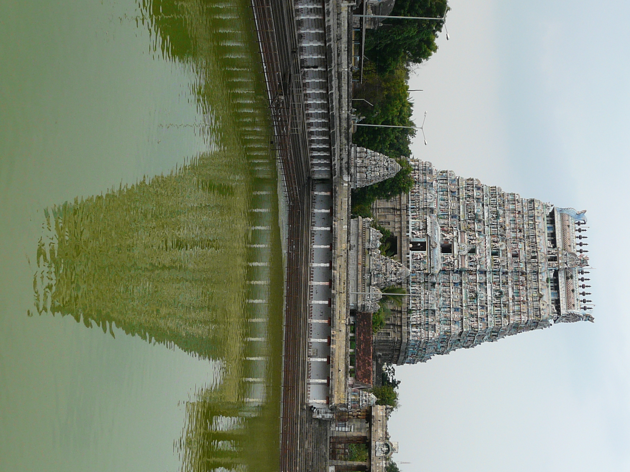 a beautiful view of the temple, its lake and surrounding building