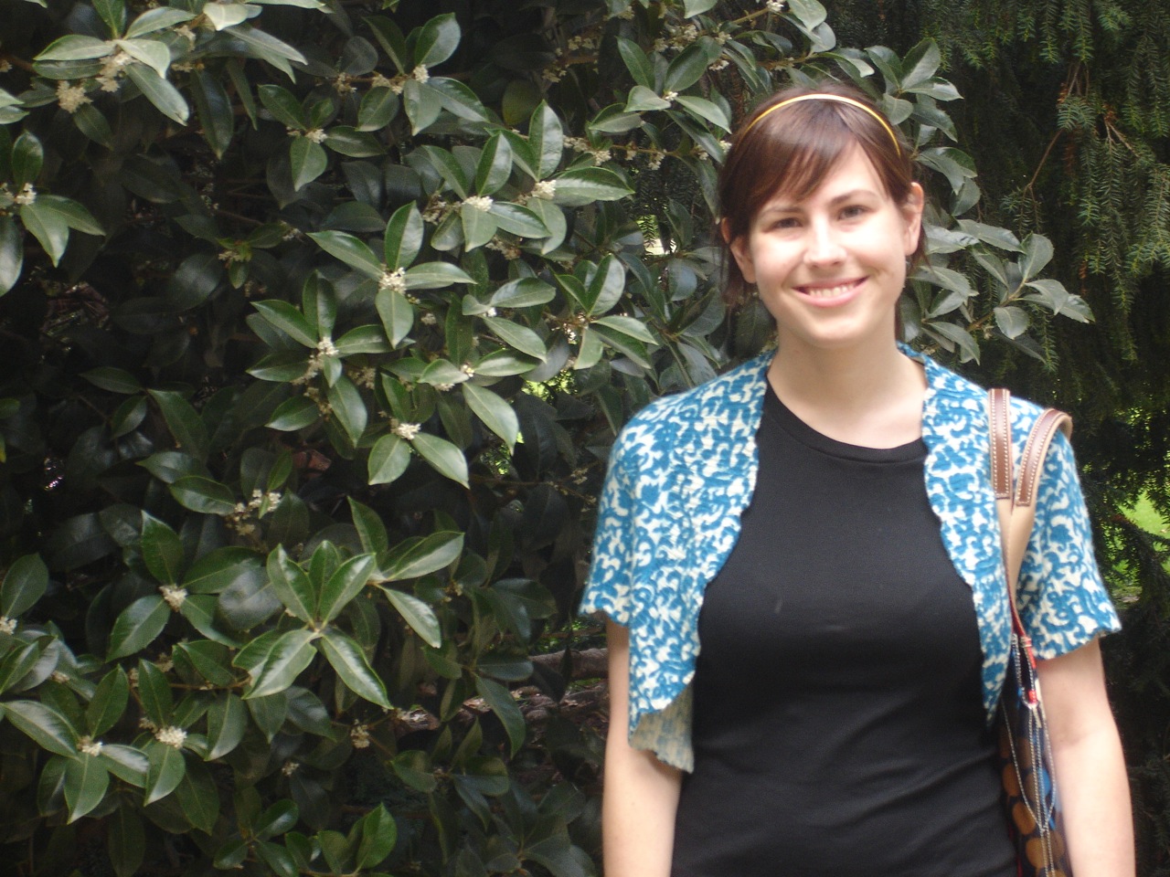 the young woman has a handbag on her shoulder