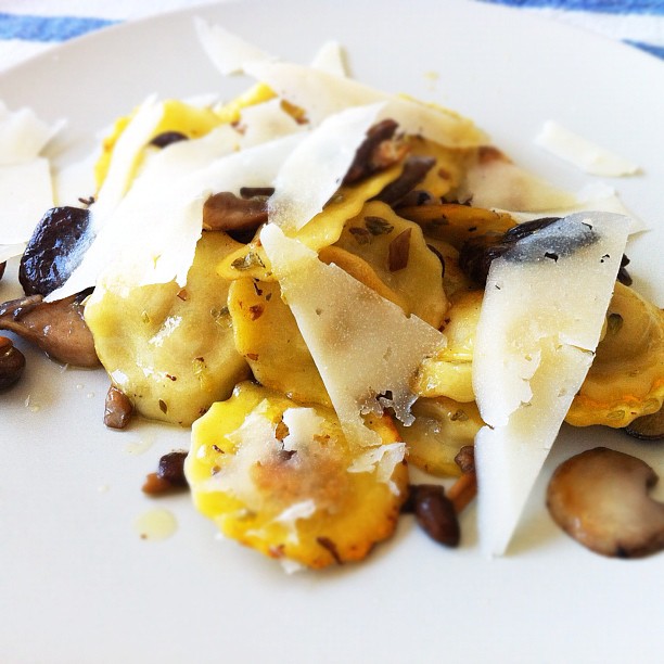 pasta with mushrooms and parmesan cheese on a plate