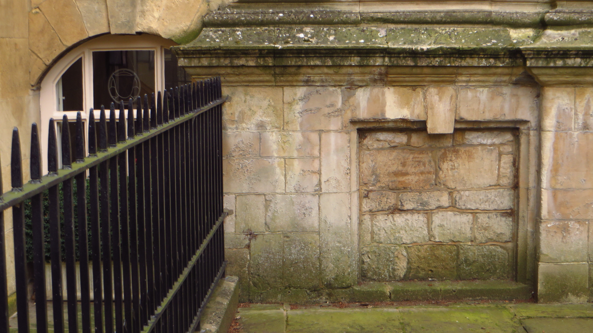 the old building has many metal and wood railings