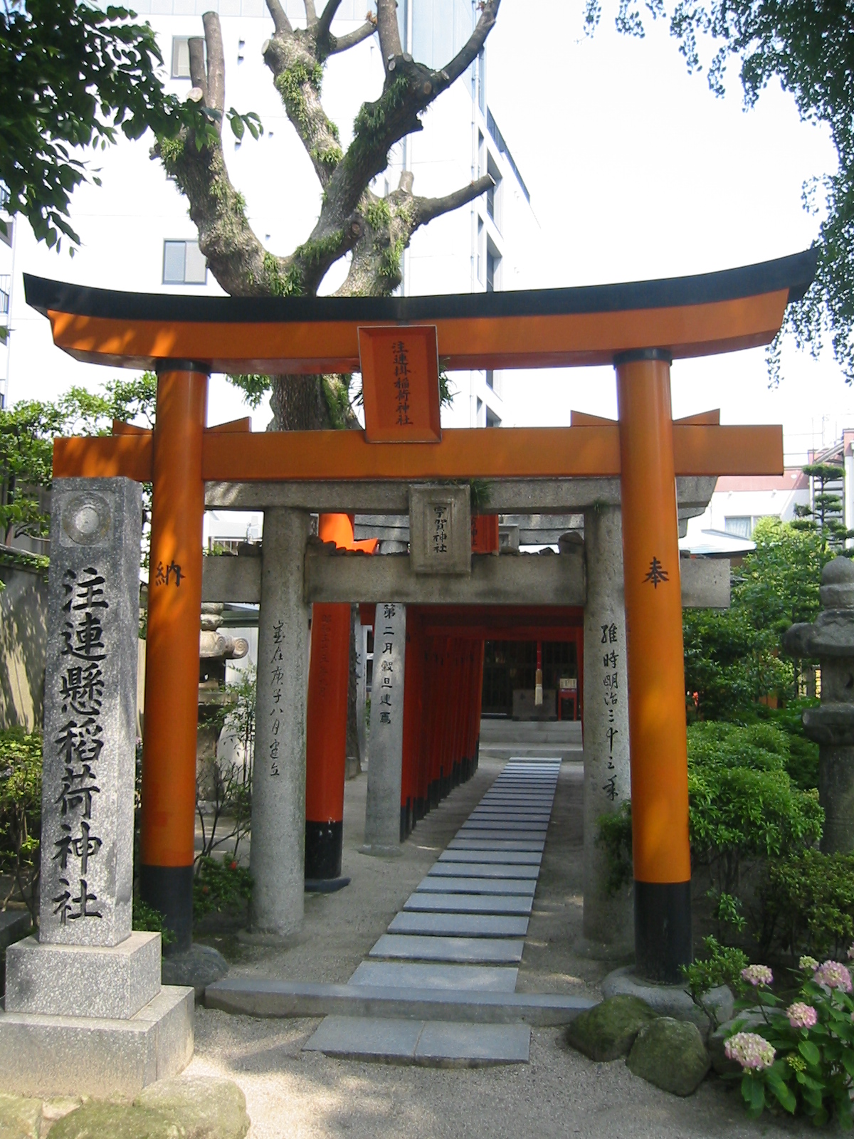 an orange arch leads into a secluded entrance