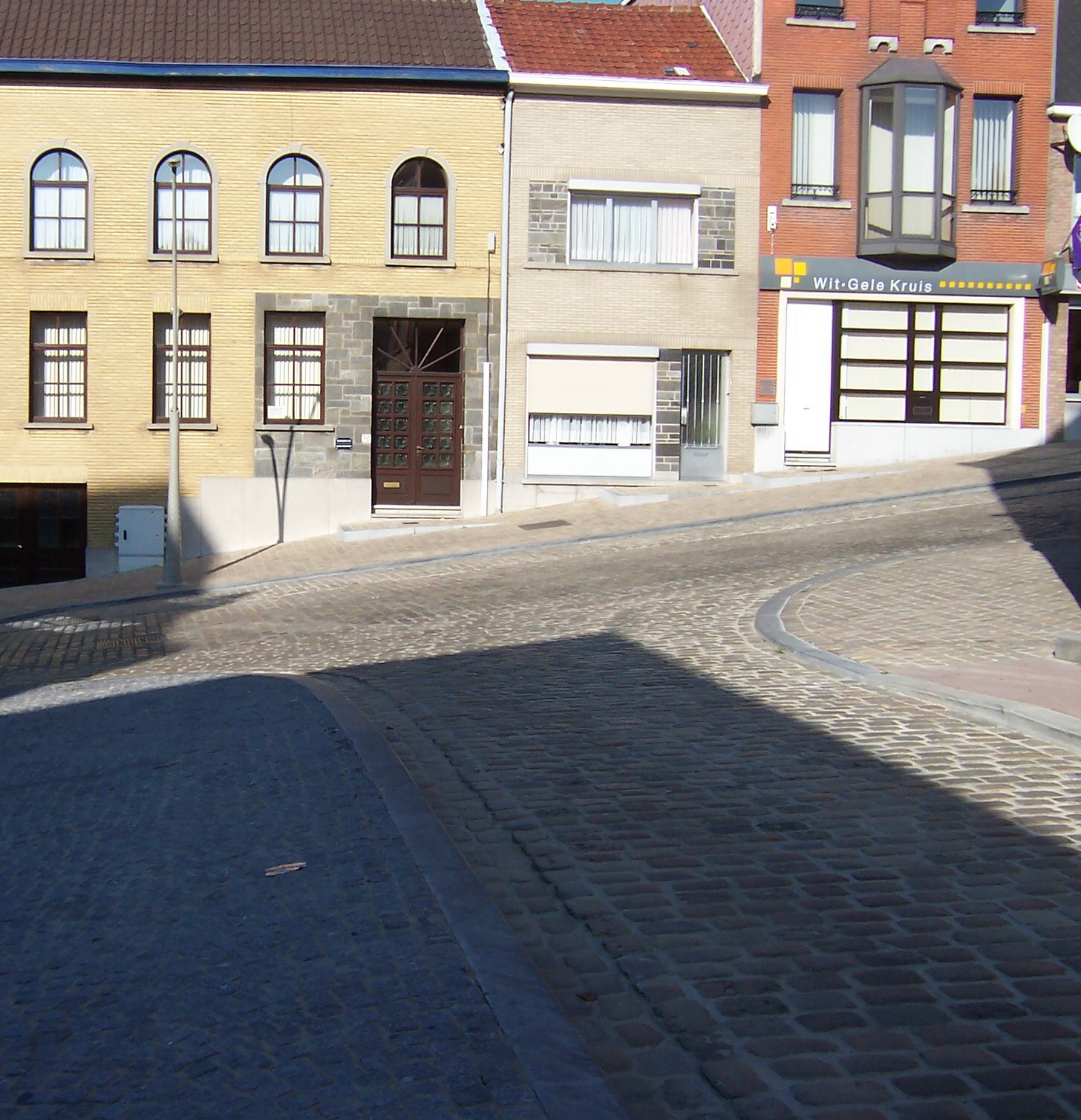 some buildings in a line on a city street