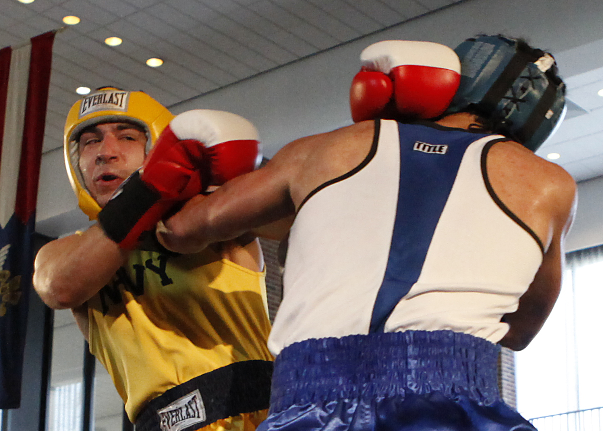 two men in red, white and blue boxing gloves