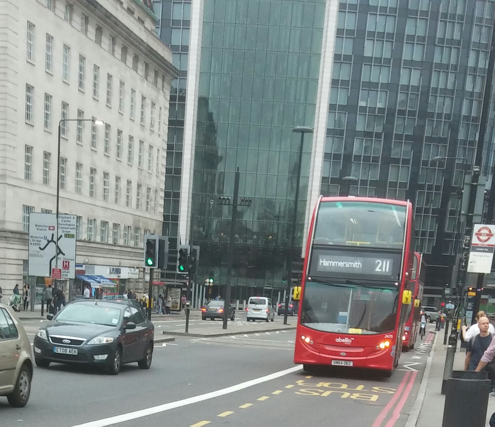 a bus travels down the road in the city