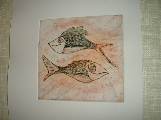 a drawing on a wall depicting two fish