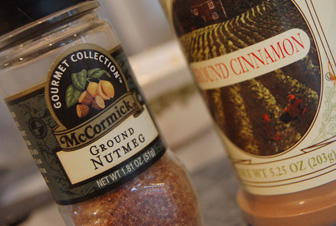 a jar of ground nutmeal next to a bottle of condiment