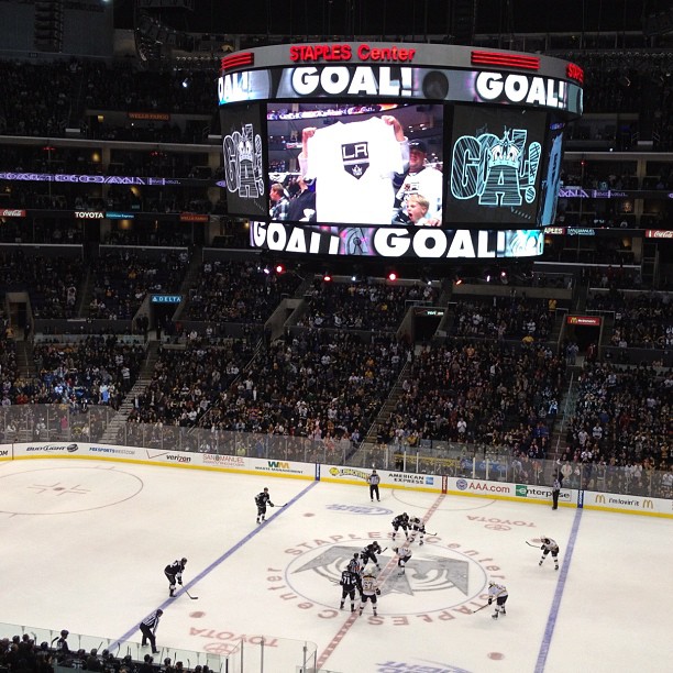 a hockey game is being played at an arena