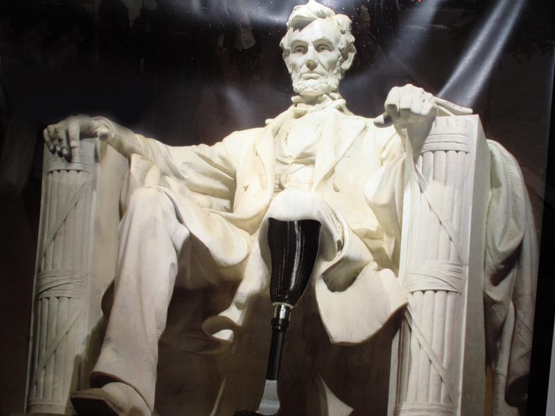 a white marble lincoln memorial has his back turned